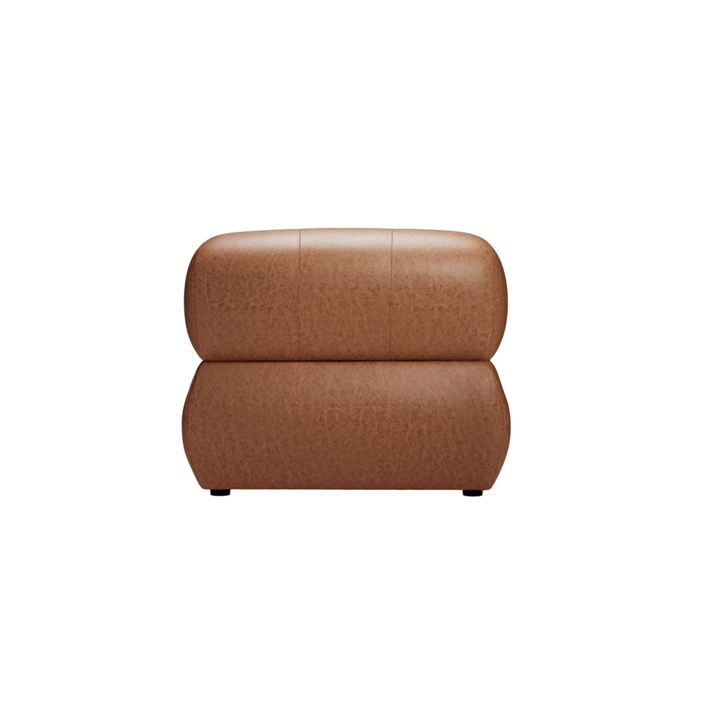 Tan leather tufted armchair