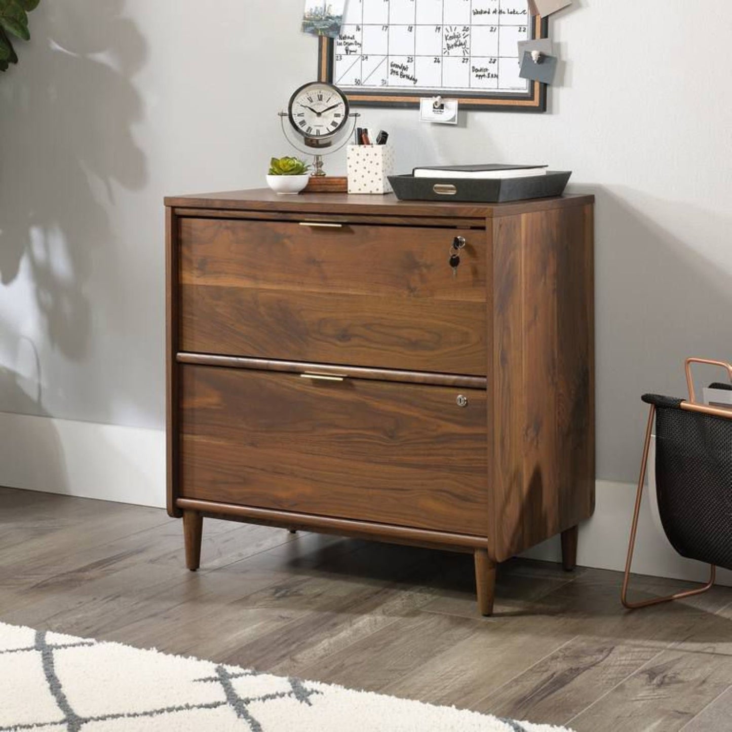Elegant lateral filer in Walnut finish in Smart Mid Century/ Retro styling with brass handles
